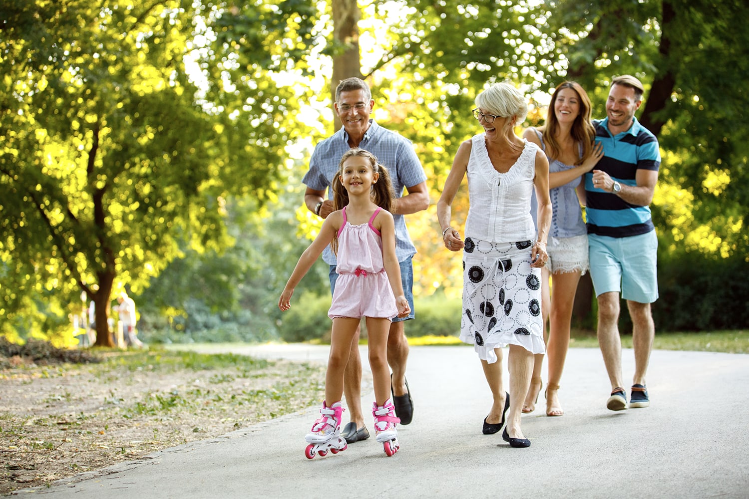Family walking outdoors representing quality-of-life hearing goals