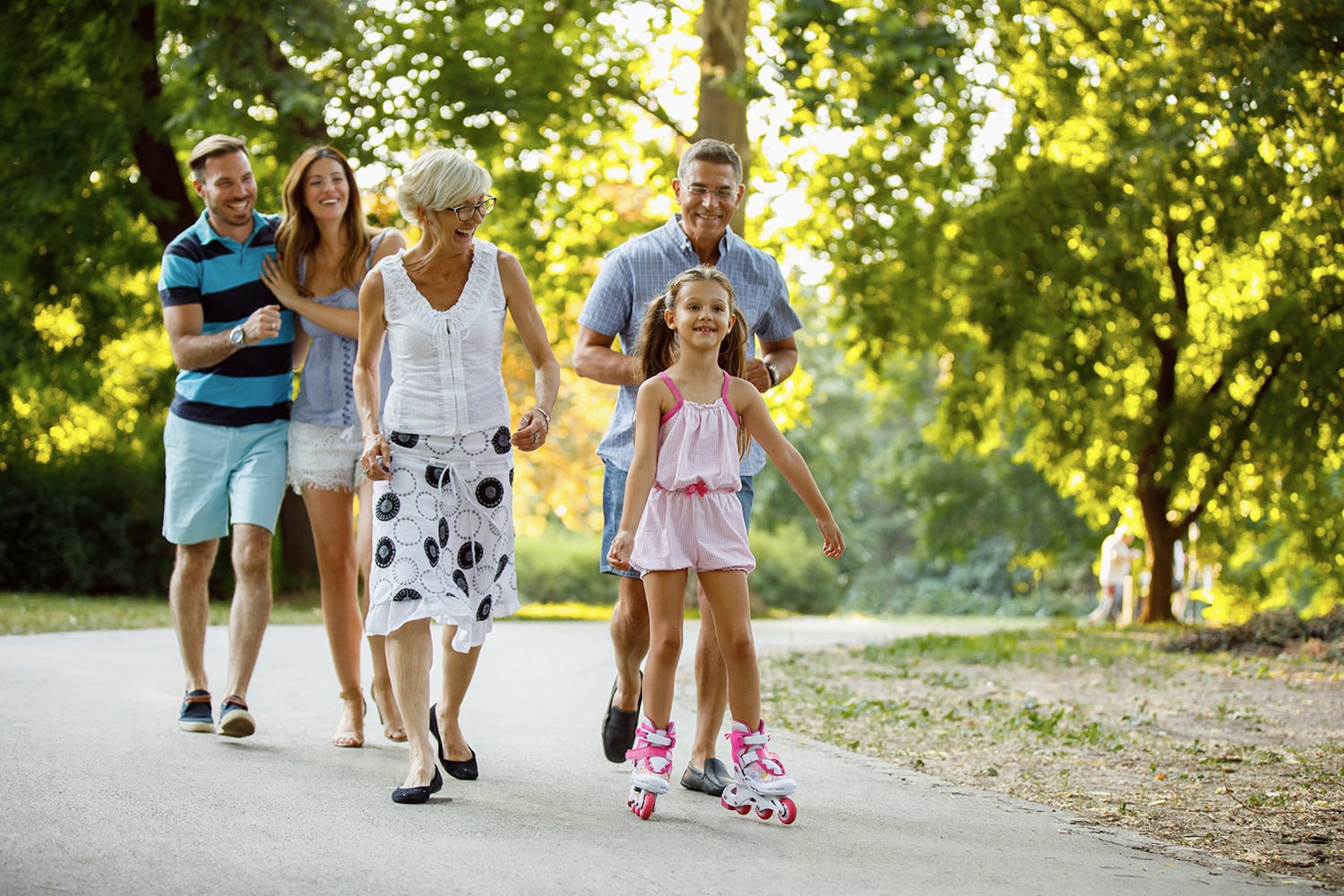 Family walking outdoors to represent lifestyle-focused hearing care